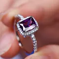 Elegant silver ring featuring rectangular purple gemstone and surrounding diamonds - Size 5 / Platinum Plated Purple Zirconia