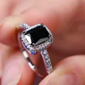 Luxury white gold ring featuring a large rectangular black gemstone with halo diamonds - Size 5 / Platinum Plated Black Zirconia
