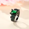 Macro view of vintage black plated ring with square green zircon and side pave stones - US 5 / Black Gold Emerald Zirconia
