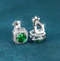Silver square clip earrings featuring a large green gemstone with white diamond halo - White Gold Emerald