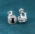 Silver clip-on earrings featuring a large round black stone with a sparkling halo - Platinum Plated Black Zirconia