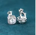 Sparkling square cut zircon stud earrings in silver finish on blue velvet fabric - White Gold With White Zirconia