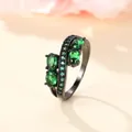 Modern black plating ring featuring oval green zircon stones and S-shaped setting - US 6 / Black Gold Emerald Zirconia