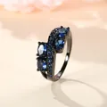 Irregular black plated ring featuring oval deep blue zircon gems in a wave design - US 6 / Black, Gold & Royal Blue