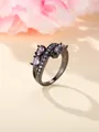 Irregular black plated ring with purple oval stones and amethyst zircons in a floral setting - US 6 / Black Gold Purple