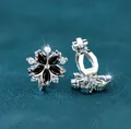 Elegant floral clip-on earrings with black petal gems and white diamond accents - White Gold Plated Black