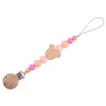 Pink silicone and beech wood baby pacifier clip with a cartoon bear design - Peach Pink