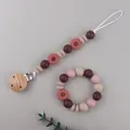 Detail of daisy silicone teething pacifier clip and matching beaded bracelet set - Dusty Pink