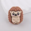 Macro shot of 3D hedgehog silicone bead with textured spines for DIY pacifier chains - Khaki