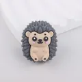 Detailed view of a cute grey and beige silicone hedgehog bead for DIY crafts and jewelry - Gray