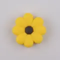 Macro detail of food-grade silicone daisy bead with yellow petals and brown center - Yellow Coffee