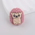 Close-up of a pink cartoon hedgehog silicone bead for DIY crafting and teething toys - Dusty Pink