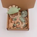 Silicone dinosaur teether and wooden ring rattle set in a premium baby gift box - Light Green