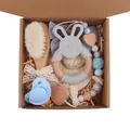 Blue newborn gift set with silicone bunny teether, wooden hairbrush, and pacifier chain - Gray