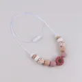 Silicone daisy teething necklace with wood beads and red sunflower pendant for infants - Mauve Sunflower Style
