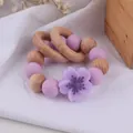 Beech wood and purple silicone flower teething bracelet for newborn babies - Purple