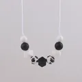 Silicone teething necklace with black beads and animal paw prints for nursing moms - Black