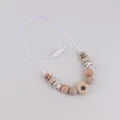 Silicone daisy teething necklace with natural wood beads in earth tones for babies - Khaki Sunflower Style