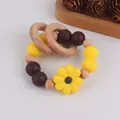 Beech wood and silicone yellow sunflower baby teether rattle with mustard beads - Yellow Coffee