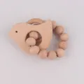 Minimalist wooden baby teether featuring a bird-shaped charm and natural round wood beads - Bird