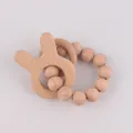 Natural wood baby teether bracelet with rabbit charm and smooth beads for newborns - Rabbit