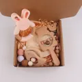 Pink silicone rabbit teether and wooden bear rattle set with matching pacifier clip - Light Pink