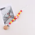 Silicone baby pacifier clip with 3D Santa Claus beads and a round wooden safety clamp - Santa Claus With Yellow Gift