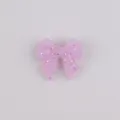 Sparkly light purple bow-shaped silicone bead with glitter for baby necklace making - Pink