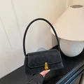 Chic black vintage textured underarm bag with gold metal clasp for modern women - Black