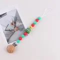 Christmas pacifier clip with red and green silicone beads and a 3D silicone tree - Christmas Tree