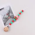 Silicone pacifier clip with Santa Claus design and red-green beads for Christmas - Santa Claus With Green Gift