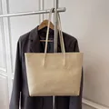 Large cream tote bag with pebble leather texture and slender shoulder straps - Off White