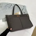 Minimalist large charcoal grey nylon tote bag with front pockets for daily commute - Gray