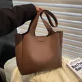 Brown faux leather tote bag with vertical stitching and top handles for women - Brown