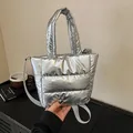 Metallic silver quilted puffer bag with horizontal stitching and fabric strap - Silver