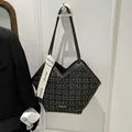 Black and gold tweed tote bag with V-shaped opening and leather handles - Black