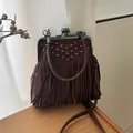 Vintage dark brown suede tassel shell bag with silver rivets and metal handle - Brown