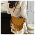 Brown faux suede crescent bag with long tassels and rivet studs in a chic bohemian style - Brown