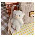 Cute cream plush bear charm attached to a brown corduroy crossbody shoulder strap - Single Bear Charm