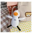 Cute white plush duck charm with orange beak hanging on a beige corduroy bag - Single Duck Charm