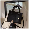 Black quilted felt tote bag with geometric pattern and mini coin purse attachment - Black