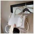 White embossed felt tote bag set with matching small pouch and gold hardware - White