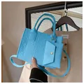 Bright blue embossed tote bag with matching mini pouch and adjustable crossbody strap - Blue