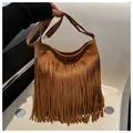 Bohemian brown suede shoulder bag with long fringe tassels and adjustable strap - Brown