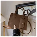 Dark brown felt tote bag with geometric embossed pattern and matching small pouch - Brown