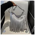 Bohemian light grey faux suede shoulder bag featuring long fringe tassels and gold hardware - Gray