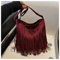 Bohemian wine red fringe shoulder bag with suede texture and silver grommet details - Red