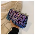 Detail view of purple gradient sequins and rhinestone ring handle on the evening clutch - Blue