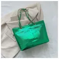 Metallic green tote bag with snake skin texture and gold chain woven shoulder strap - Green