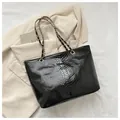 Fashionable black faux snakeskin tote bag with elegant gold chain leather shoulder straps - Black